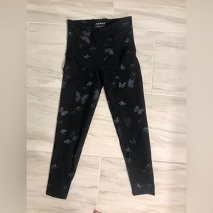 Spanx small leggings. Black with butterfly print. Never been worn!!!